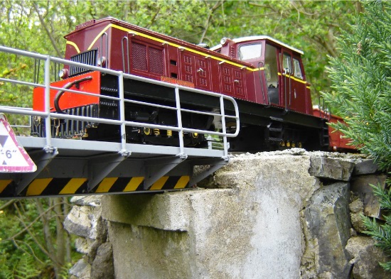 Castell Caernarfon crosses Nantmor Road bridge with a SAR/SAS B class wagon and a V16 Brake van in tow.